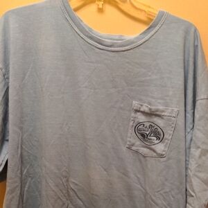 Men's Coastal Waves Light Blue T-Shirt front pocket. Fish logo on back